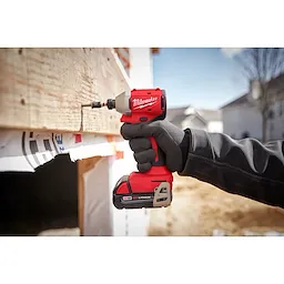 Worker using the Compact Brushless 1/4" Hex 3-Speed Impact Driver to drive a screw in wood