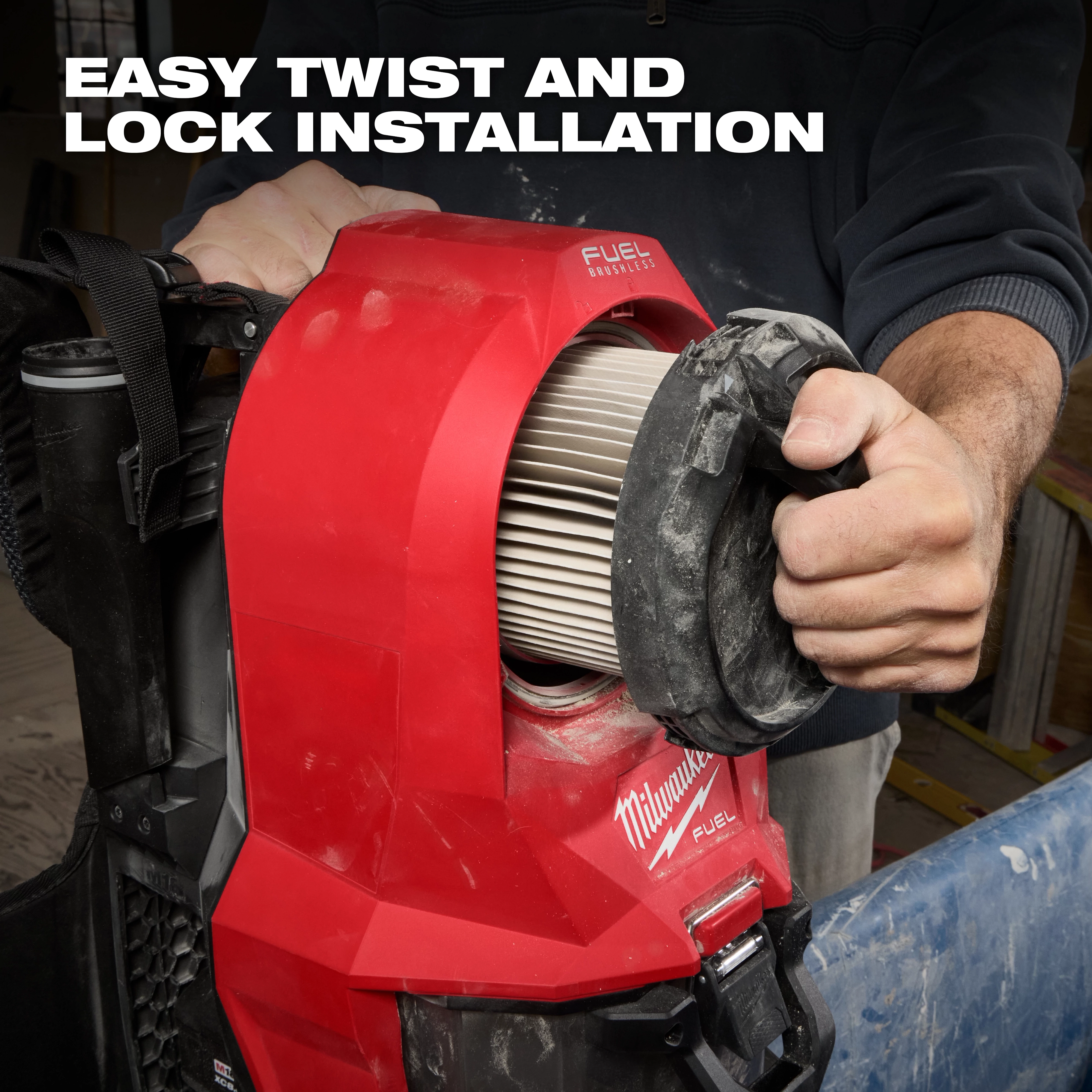 A person installs a Milwaukee Fuel HEPA Filter with a twist and lock mechanism. The HEPA Filter is shown inside a red casing with branding visible. The caption "Easy twist and lock installation" is displayed at the top of the image.