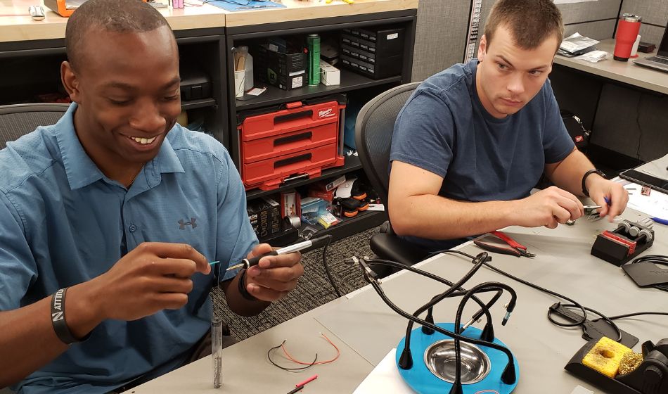 two engineers working in hands-on lab